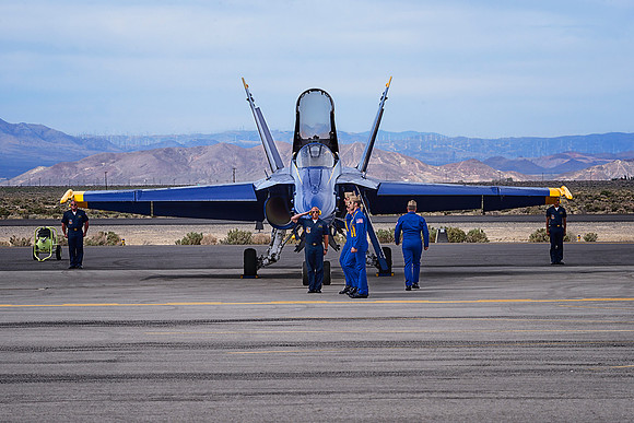 Blue Angel Pilots walk down to their F-18