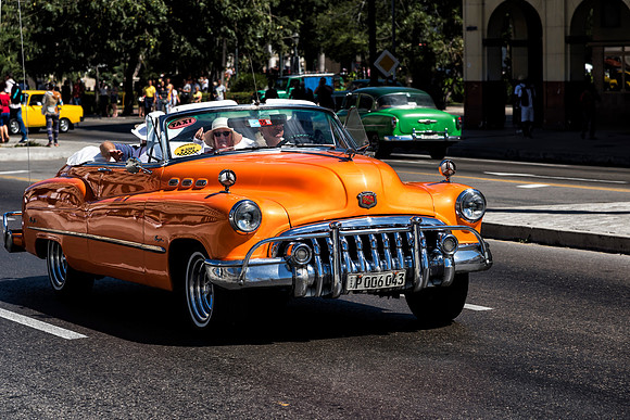 Orange Buick convertible Havana Taxi