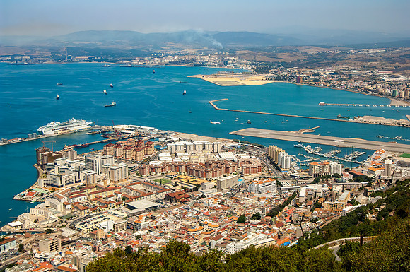 Plane landing on runway which separates Spain from Gibraltar