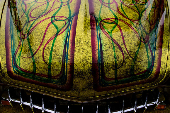 Custom Mercury Hood Paint of Green and Red on Gold